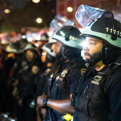 Protestors demonstrate in New York City before being removed by NYPD officers for disorderly conduct.