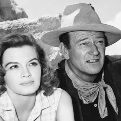 Actors Angie Dickinson and John Wayne star in the western 'Rio Bravo', 1959.