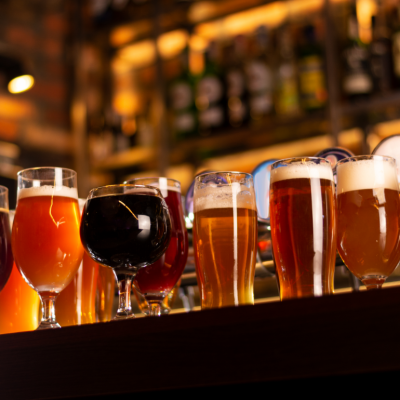 Different types of beer on a bar.