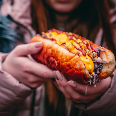 Close-up of a person holding a Philly Cheesesteak