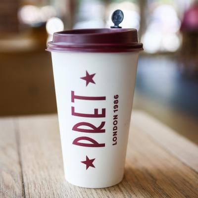 A paper coffee cup is seen on a table in Pret A Manger shop in Manhattan in 2024.