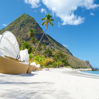 A row of luxury chairs on the Sugar Beach in Saint Lucia island.