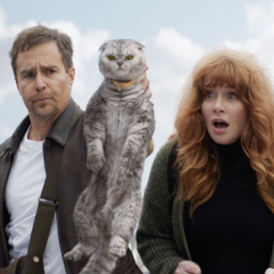 Sam Rockwell and Bryce Dallas Howard with a cat in a scene from 'Argylle' 