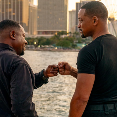 Martin Lawrence and Will Smith fist bumping in a scene from 'Bad Boys: Ride or Die'