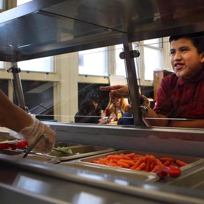 Moises Gaspar chooses his lunch as he takes part in the nutrition program at Bradley Elementary school in East Boston.