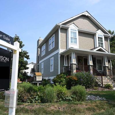 A 'for sale' sign in the front yard of a craftsman home in Arlington, Virginia, in 2023.