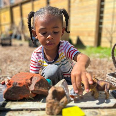 A 3-year-old boy plays in an outdoor classroom at Early Partners, a child care center in New Orleans that participates in City Seats, a tax-funded program that pays for child care.