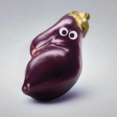 An eggplant with googly eyes.