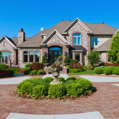 A luxury home with an expansive circular driveway.