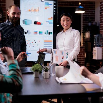 A business group discussing results in a meeting.