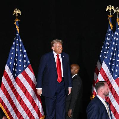 Secret service agents stand guard around presidential candidate Donald Trump.