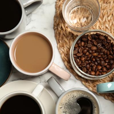 A flatlay of cups of different types of coffee and tea.