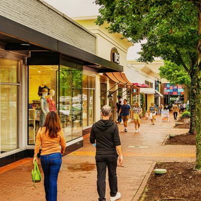 Shoppers walking in a village district in North Carolina.