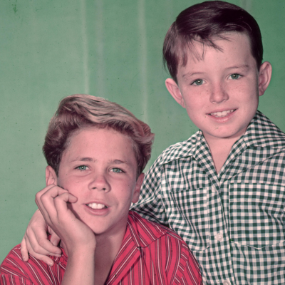  American actors Tony Dow (L)and Jerry Mathers pose together in a promotional portrait for the television show, 'Leave It to Beaver,' circa 1955.