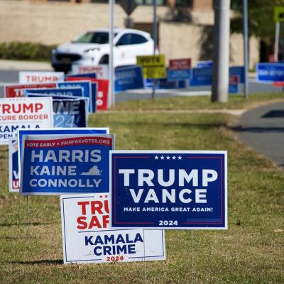 Campaign signs placed on a median lawn for presidential candidates in Fairfax, VA.