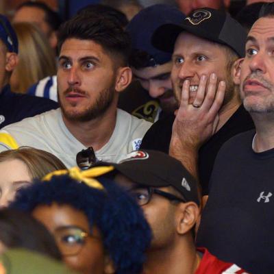 Photo of football fans watching NFC championships in a sports bar. 