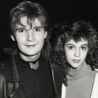 Actors Corey Feldman and Alyssa Milano during the 1987 American Music Awards in Los Angeles.