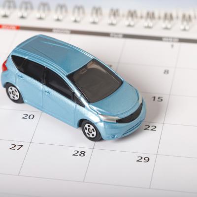 A car figure on top of a calendar.