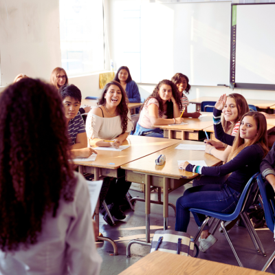 A high school classroom with teacher and students.