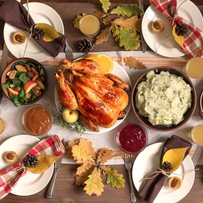 A traditional homemade Thanksgiving feast with autumnal decor.