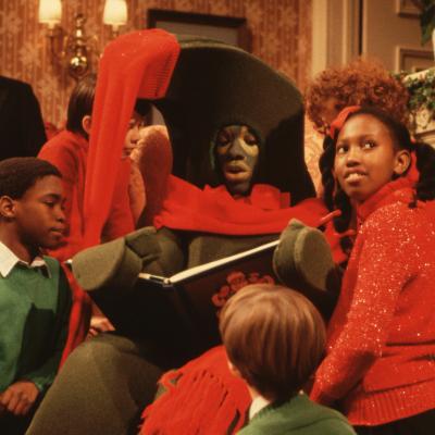 Children gather around Eddie Murphy performing as Gumby in a Christmas skit on 'Saturday Night Live.'