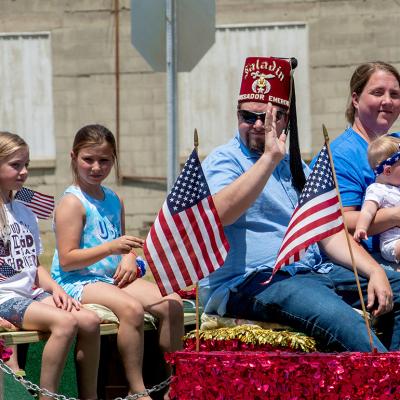 A member of the Saladin Shriners rides on a float in a parade in Michigan.