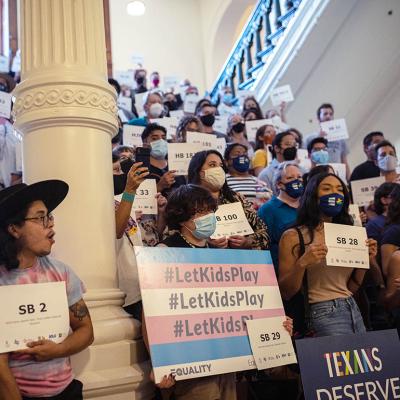 LGBTQ rights supporters gather at the Texas State Capitol to protest state Republican-led efforts to pass legislation that would restrict the participation of transgender student athletes in 2021.