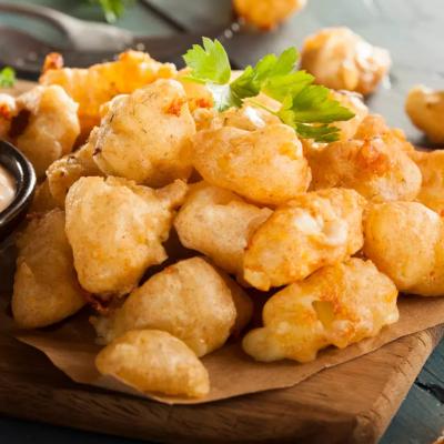 Beer battered Wisconsin cheese curds with dipping sauce.