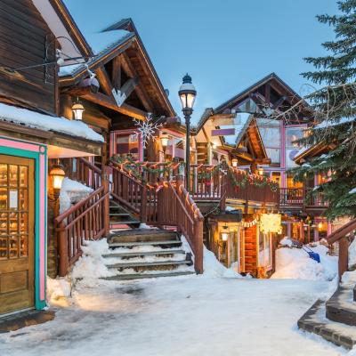 Streets decorated for Christmas in Breckenridge, Colorado, at night.