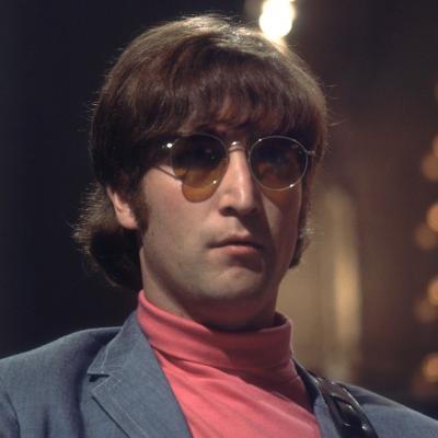 John Lennon of The Beatles wearing sunglasses in 1966.