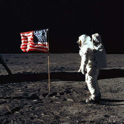 Astronaut Edwin E. "Buzz" Aldrin, Jr., beside the U.S. flag during an Apollo 11 moon walk, 1969. 