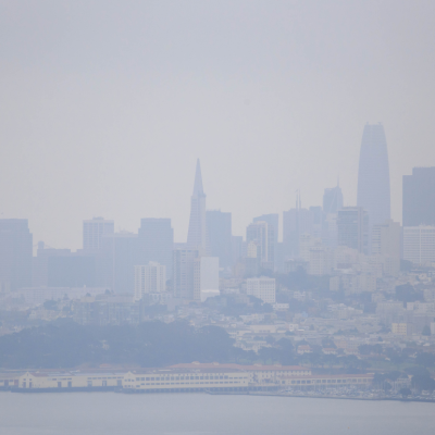 Smoke from wildfires causes hazy conditions over San Francisco skyline on sunny day