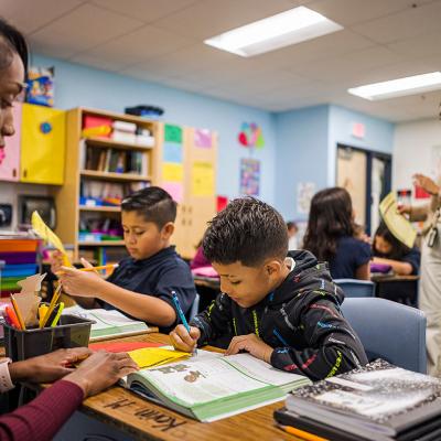 Two elementary school teachers in Nevitt Elementary School, Arizona whose class is in session.