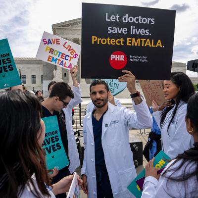 Doctors join abortion rights supporters at a rally outside the Supreme Court on April 24, 2024 in Washington, DC.