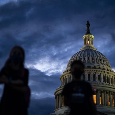 Silhouette of children in front of the Capitol Dome during sunset on Capitol Hill in Washington, DC.