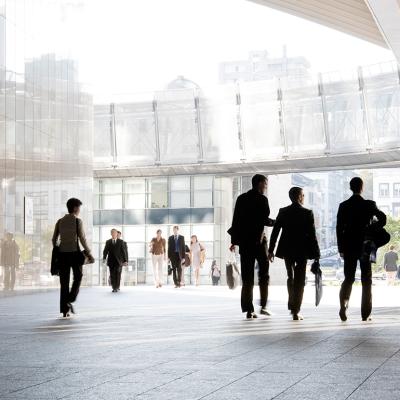 Business people leaving from their office building.