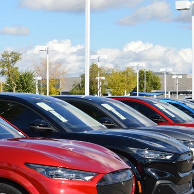 Used SUVs up for sale in a parking lot.