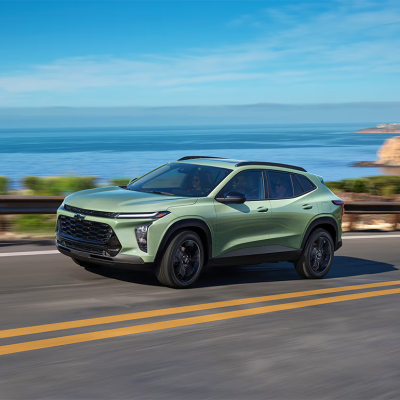 A green 2025 Chevrolet Trax on the road.