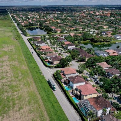 In an aerial view, urban sprawl along SW 157 avenue is nestled next to protected wetlands and farmland on the fringes of Everglades National Park.