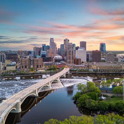 Aerial view of Minneapolis, Minnesota's downtown skyline with a view of the river.