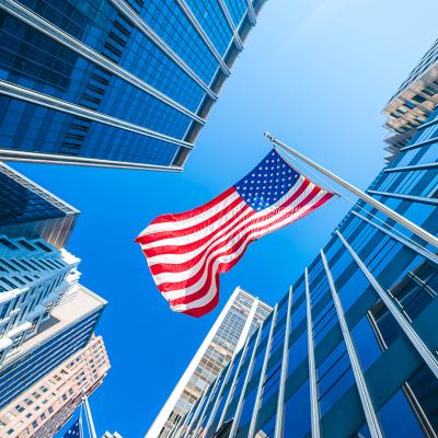 Business or finance district concept; modern buildings and the US flag.