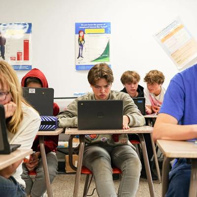 Students graph linear equations in ninth-grade algebra class at Braham Area High School in Minnesota.