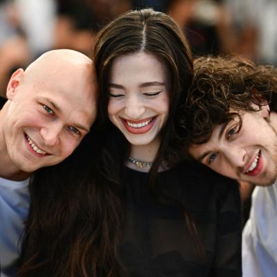 "Anora" stars Yuriy Borisov, Mikey Madison, and Mark Eydelshteyn pose at the Cannes Film Festival on May 22, 2024.