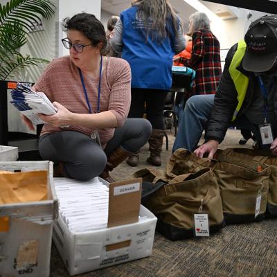  Denver Elections personnel administrator Elizabeth Littlepage, left, and election worker William Goad, sort through ballots that need to go to specific counties at the Denver Elections Division.