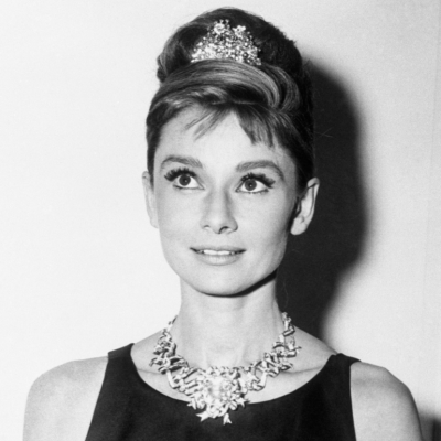 Audrey Hepburn, in the now-iconic outfit in 'Breakfast At Tiffany's,' wears one of the store's most expensive diamond necklaces.