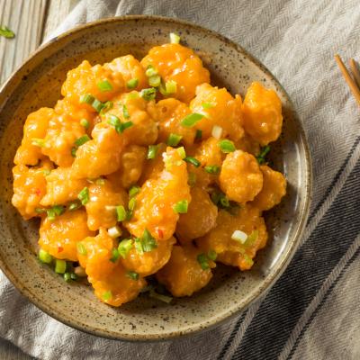 Homemade Asian bang bang shrimp with green onions.