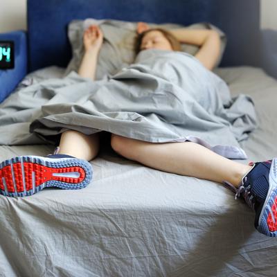 A woman who got ready for a fitness training goes back to bed.