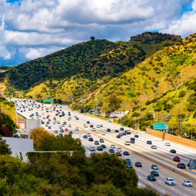 Aerial view of California Interstate 405 near Los Angeles surrounded by green hills