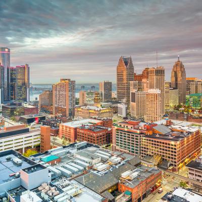 A view of Detroit, Michigan's skyline during dusk.