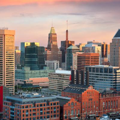 A view of the skyline during dawn over the Inner Harbor in Baltimore, Maryland.